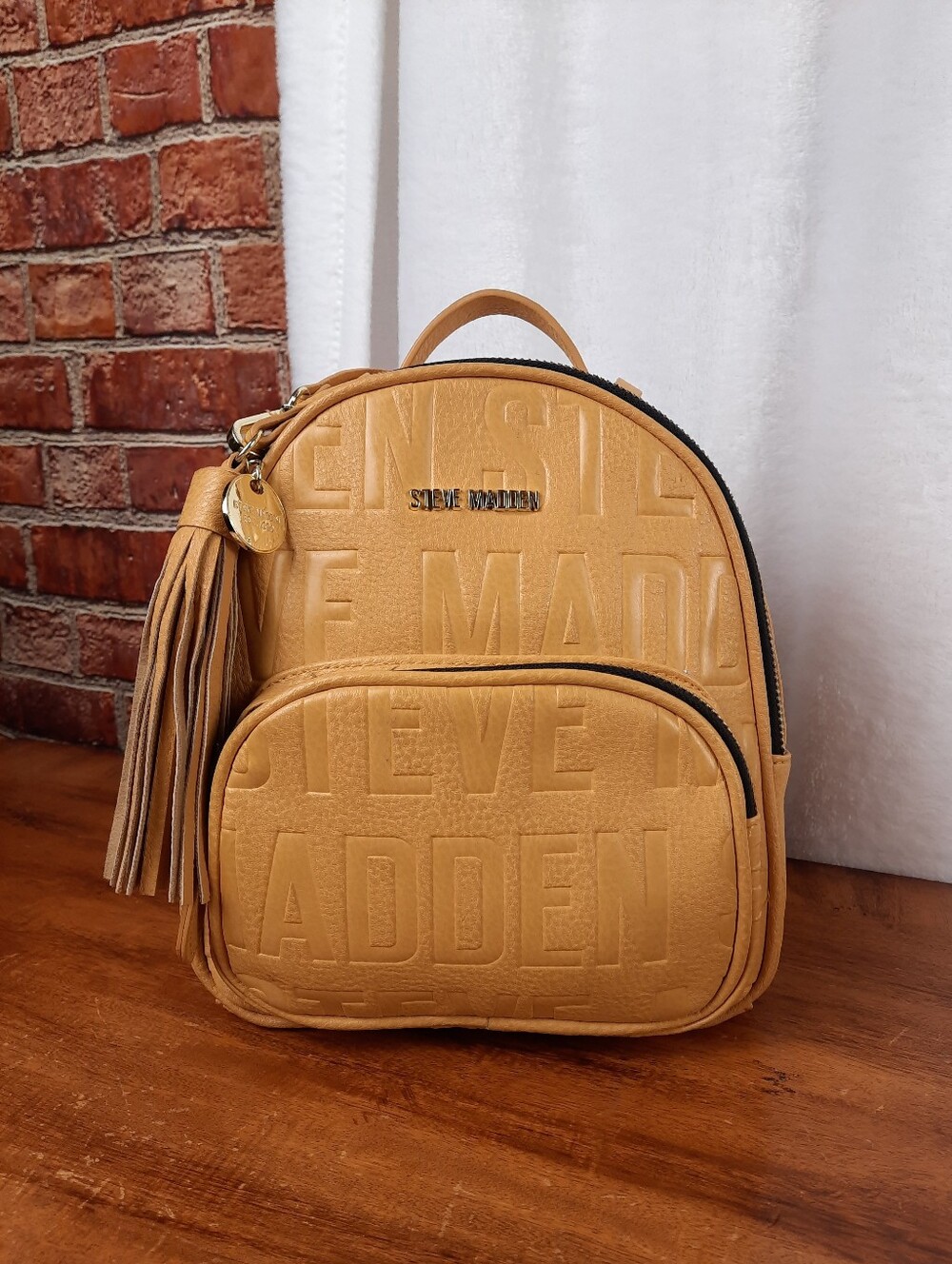 Steve Madden Mustard Mini Tassel Backpack